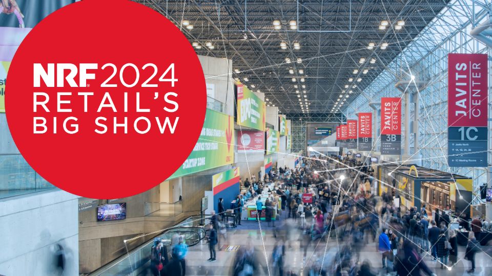 showcard for sensormatic solutions at nrf big show 2024 with crowd and banners in the hall of jacob javits convention center in nyc