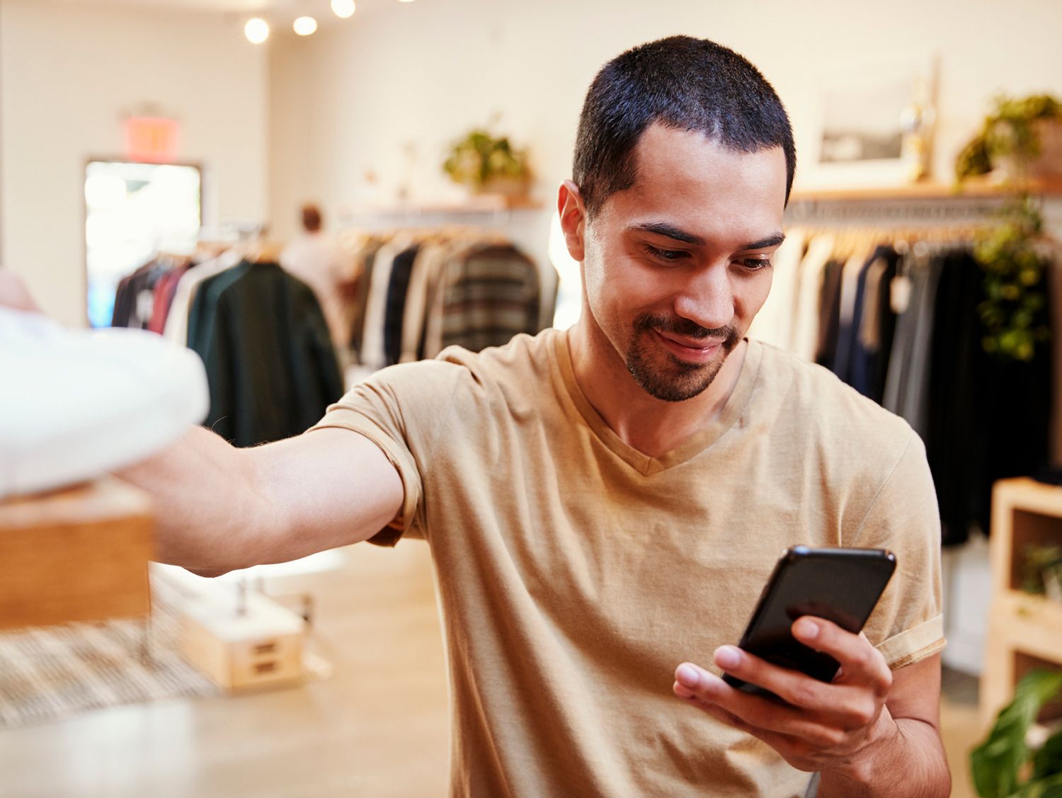 shopper viewing phone in store