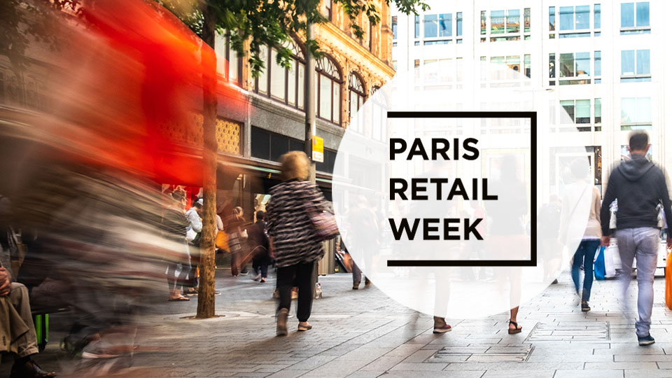 busy shopping street filled with customers visiting retail stores