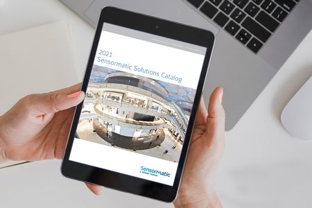 hands holding a tablet displaying sensormatic 2021 product catalog