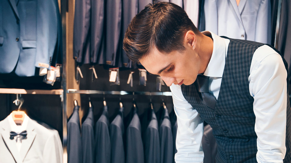 male retail store sales associate working in retail mens apparel store