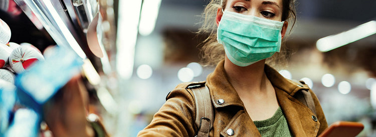 woman wears covid-19 mask while shopping